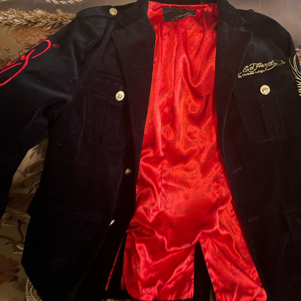 Black intricate designs, vibrant colors. Truly an original! Bright red interior.